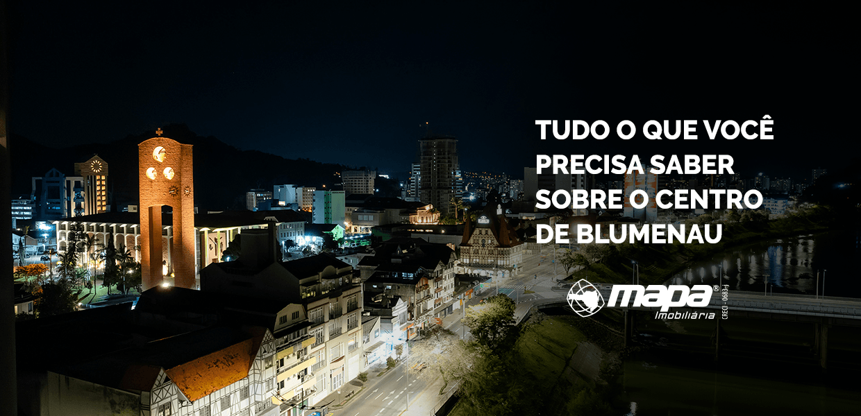 Imagem de capa do artigo sobre o bairro Centro de Blumenau com vista noturna da região central e identidade visual do conteúdo.